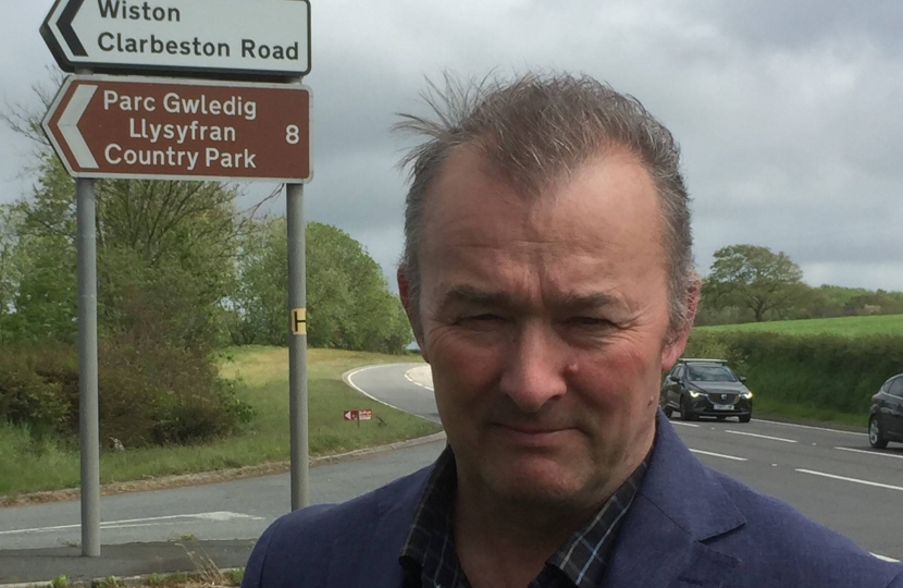  Simon Hart MP pictured at the Llys Y Fran Country Park sign on the A40 near Slebech.  The attraction has been closed since last year and will remain closed for some time to come.