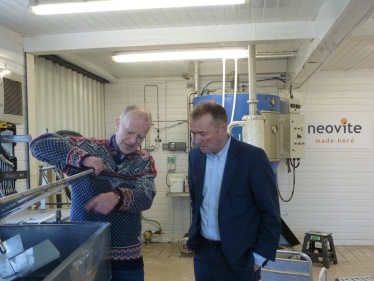 Businessman John Rolfs shows Simon Hart MP around the Neovite plant in Bethesda near Narberth 
